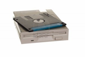 12047659-floppy-disk-drive-with-diskettes-isolated-over-white